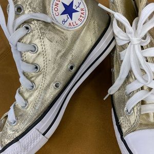 Gold high top converse